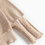 Beige cardigan med guldglimmer og fine ribdetaljer til børn