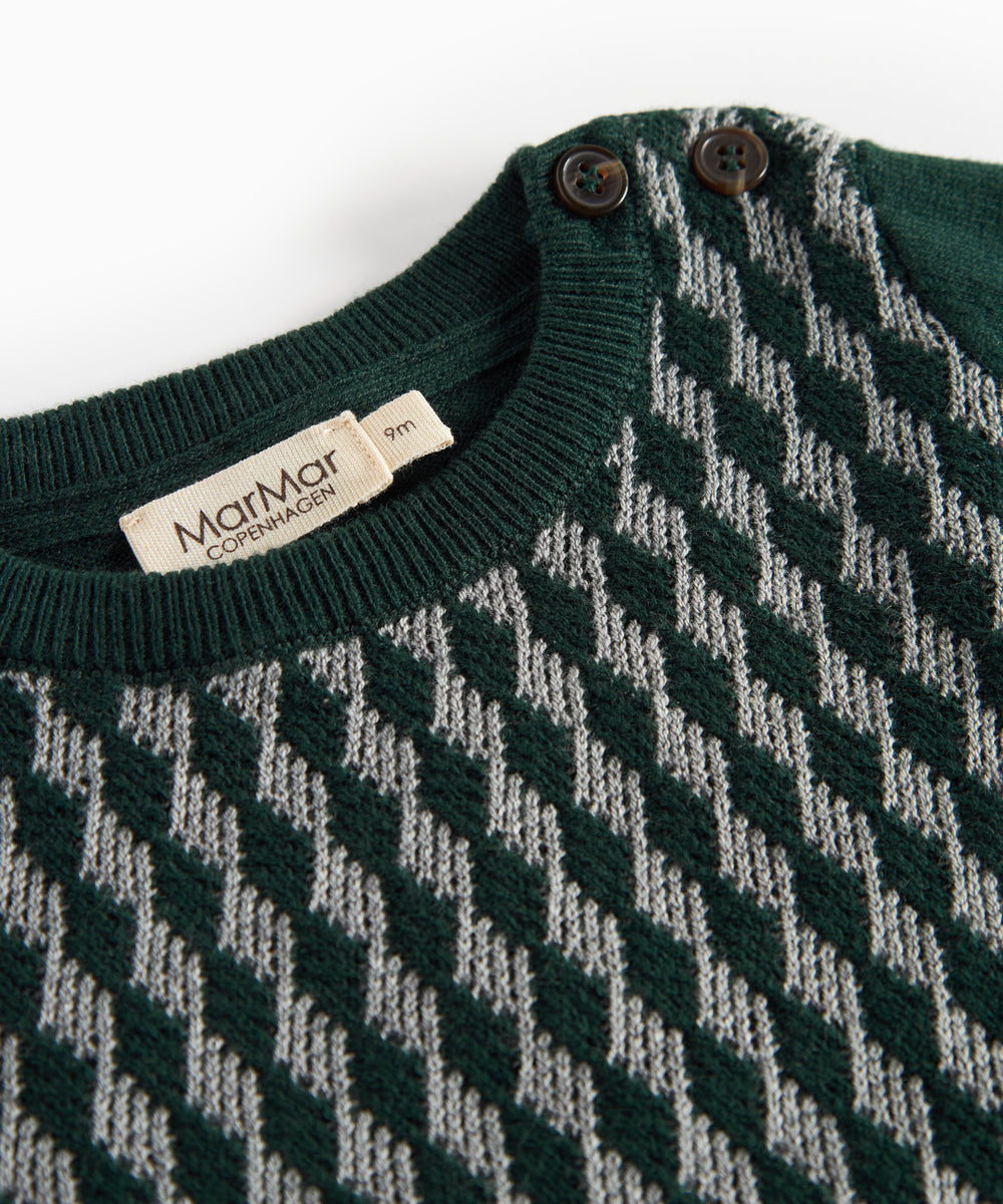 Strikket babybluse med ternet mønster i mørkegrøn