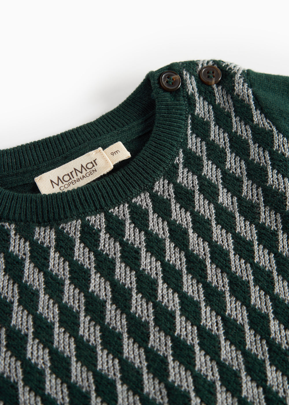 Strikket babybluse med ternet mønster i mørkegrøn