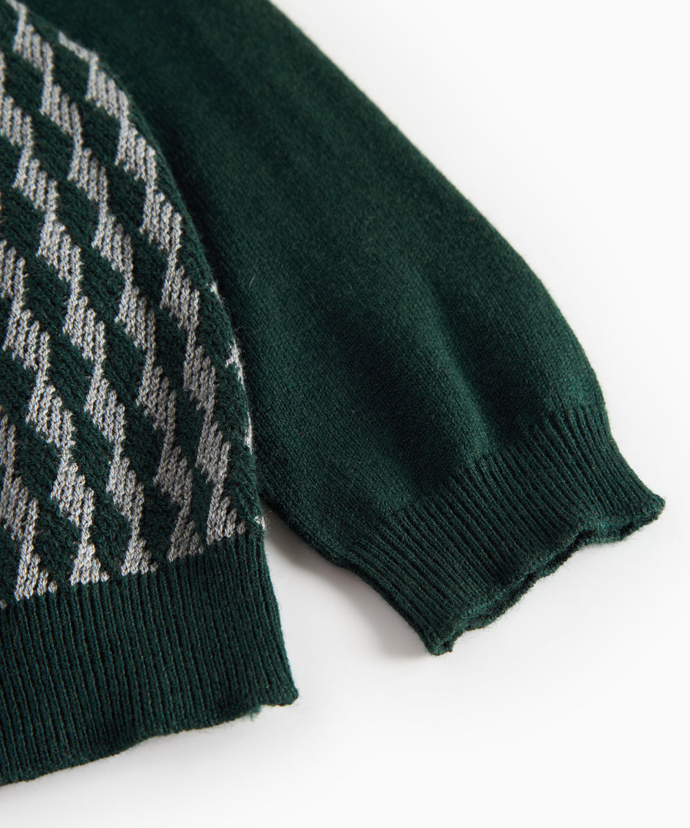 Strikket babybluse med ternet mønster i mørkegrøn