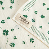 Beige towel with green clover print