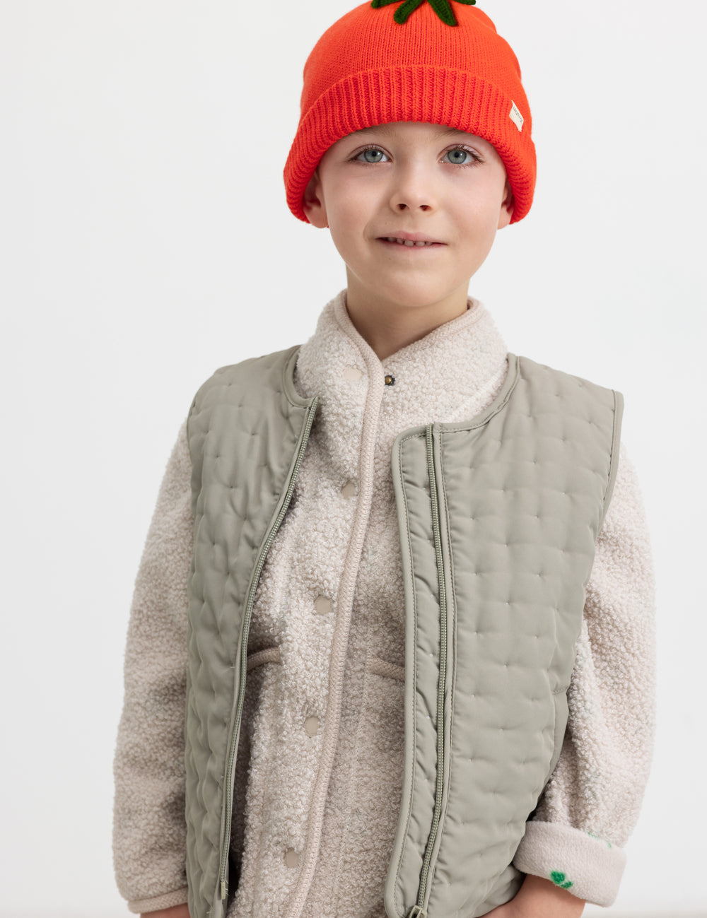 Red striped hat worn by a child.