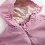 Details of a yellow transition jacket with water beads on the fabric.