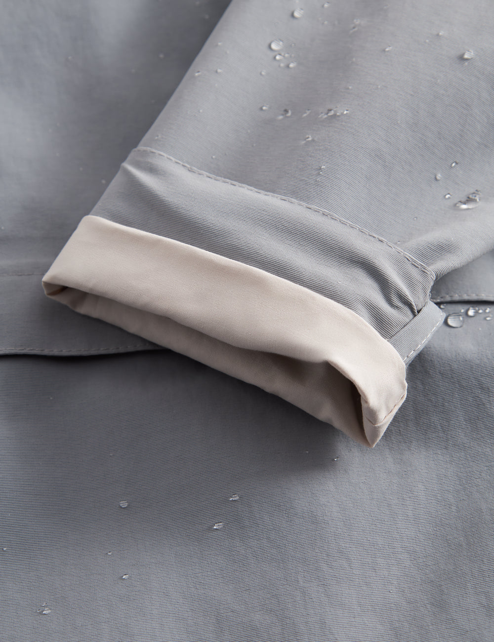 Gray transition jacket with hat, zipper, and pockets for baby