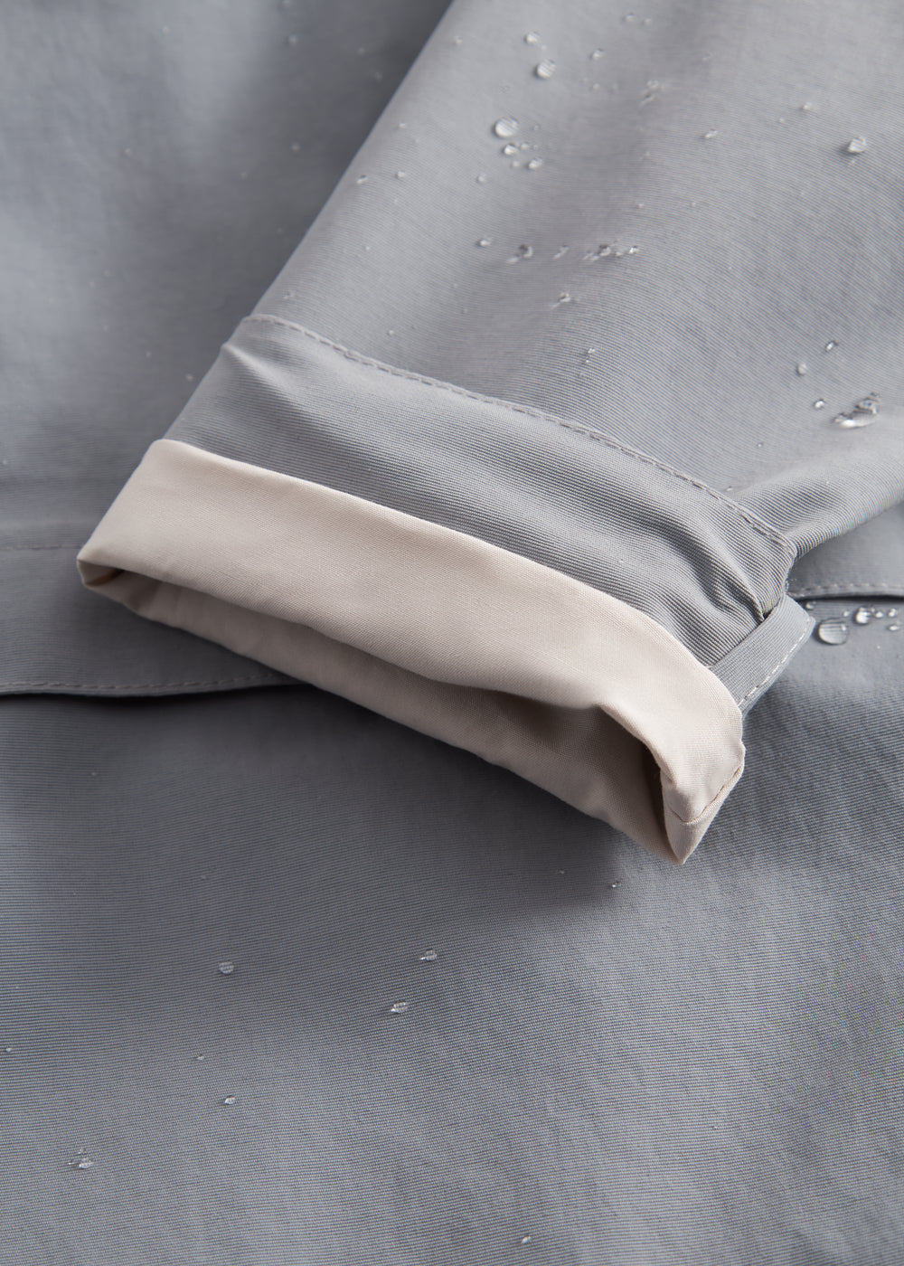 Gray transition jacket with hat, zipper, and pockets for baby