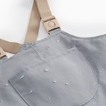 Gray overalls with pockets and footies for children