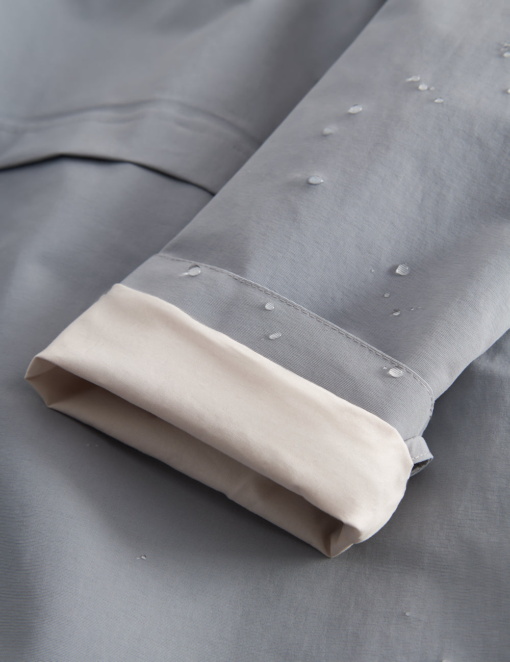 Grå overgangsjakke med hætte og lommer til børn