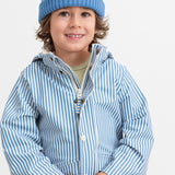 A child wearing a blue knitted hat and striped raincoat.
