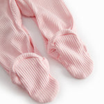 Red long-sleeved baby outfit with feet and buttons.