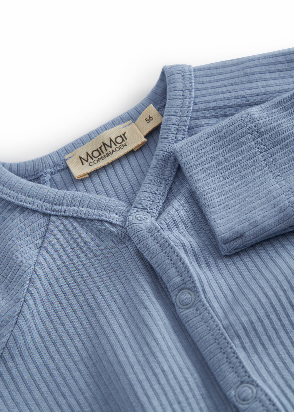 Light blue long-sleeved baby outfit with feet and buttons