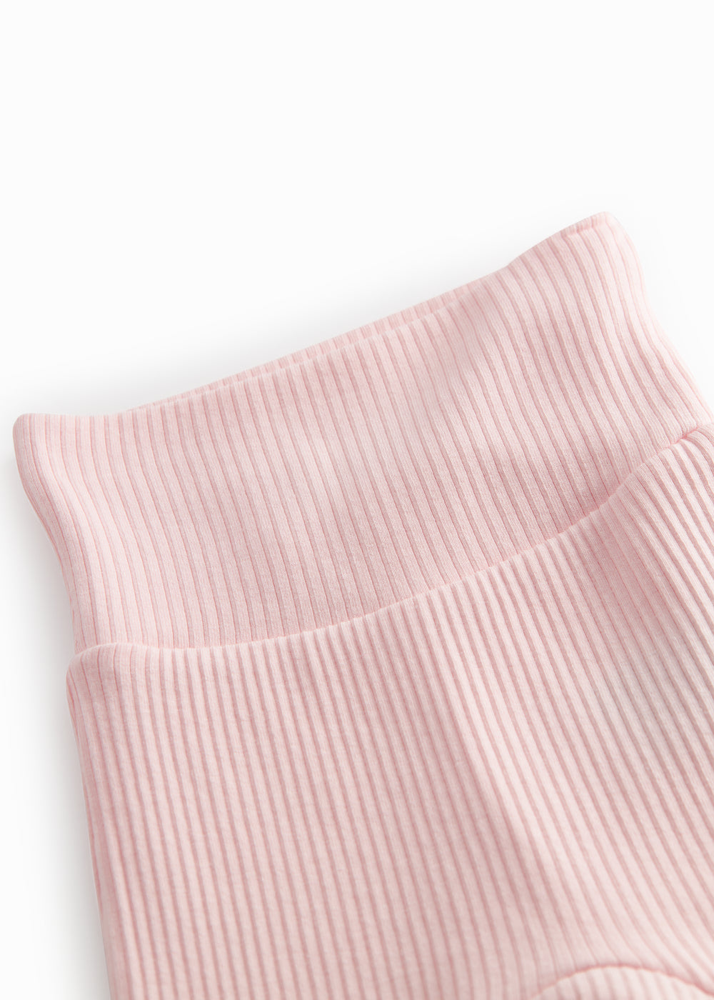 Lyserøde babybukser med fødder til de nyfødte