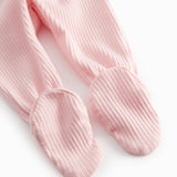 Red baby pants with feet for newborns.