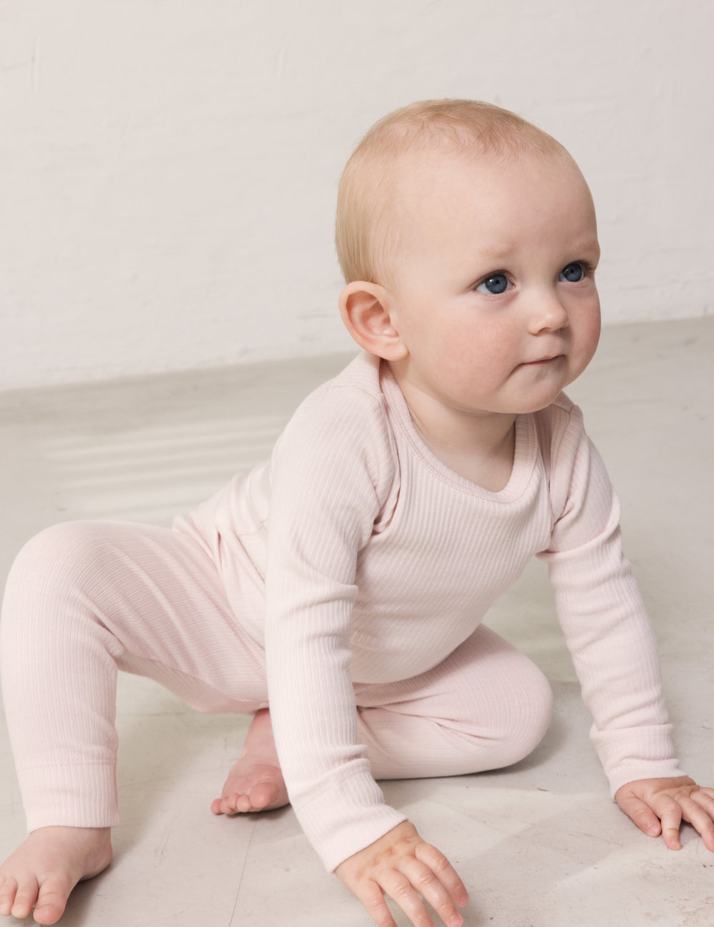 Children wearing long-sleeved ribbed modal t-shirts and leggings in light blue.