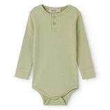 Green long-sleeved baby bodystocking with snap closure.