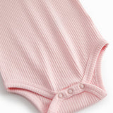 Red long-sleeved baby bodystocking with snap closure.