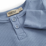 Light blue long-sleeved baby bodystocking with snap closure