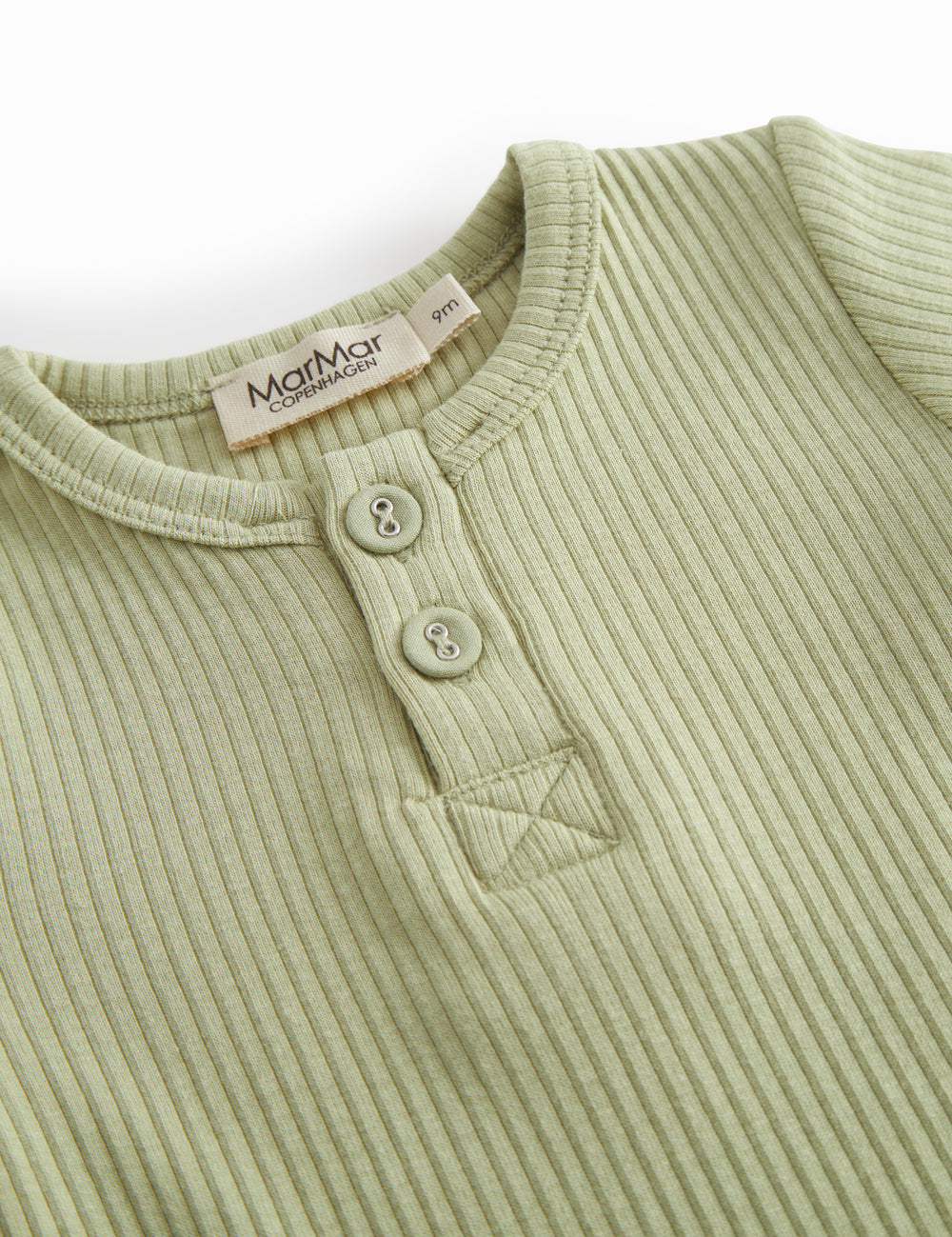 Red short-sleeved baby bodystocking with garter snap closure.