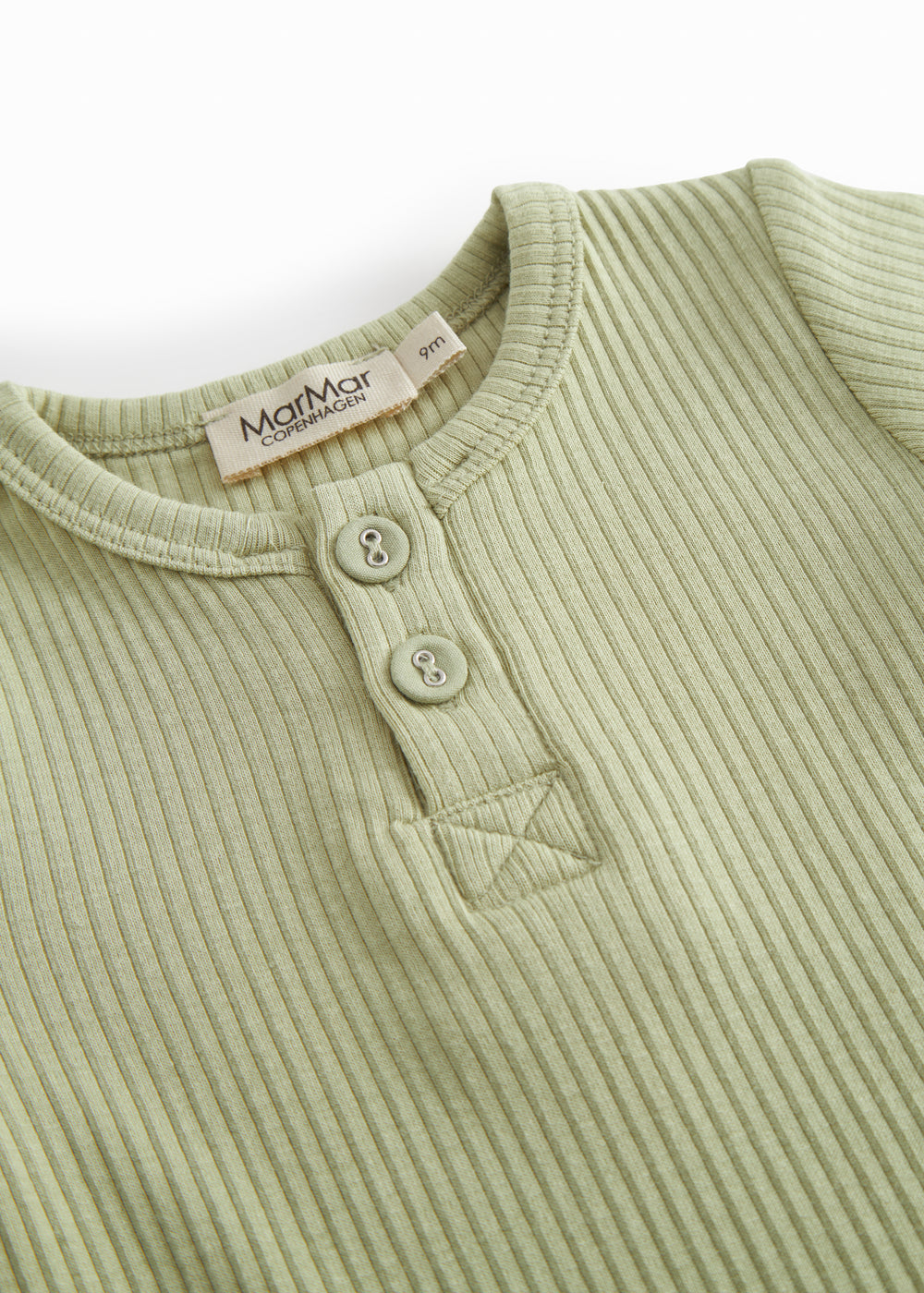 Red short-sleeved baby bodystocking with garter snap closure.