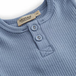 Light blue short-sleeved baby bodystocking with snap closure