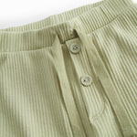 Green baby bloomers with snap closure