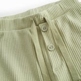 Green baby bloomers with snap closure