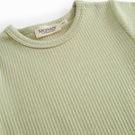 Short-sleeved baby modal romper with short legs in a light green shade.