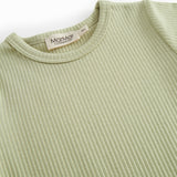 Short-sleeved baby modal romper with short legs in a light green shade.