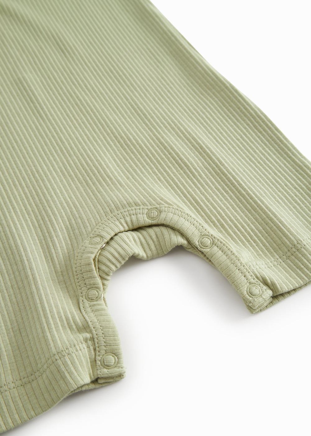 Short-sleeved baby modal romper with short legs in a light green shade.