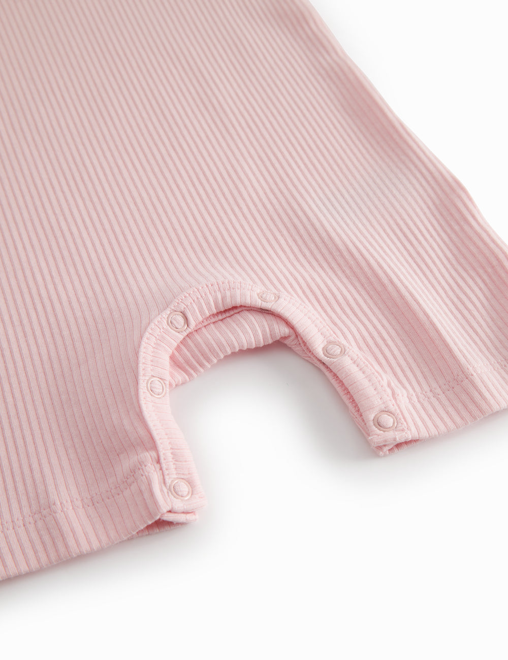 Short-sleeved baby modal romper with short legs in a light red shade.