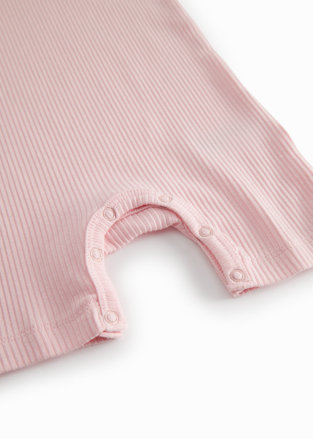 Short-sleeved baby modal romper with short legs in a light red shade.