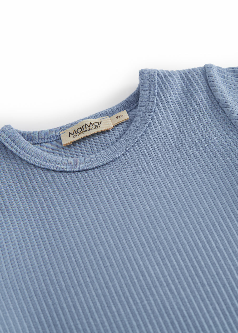 Short-sleeved baby modal romper with short legs in a light blue shade.