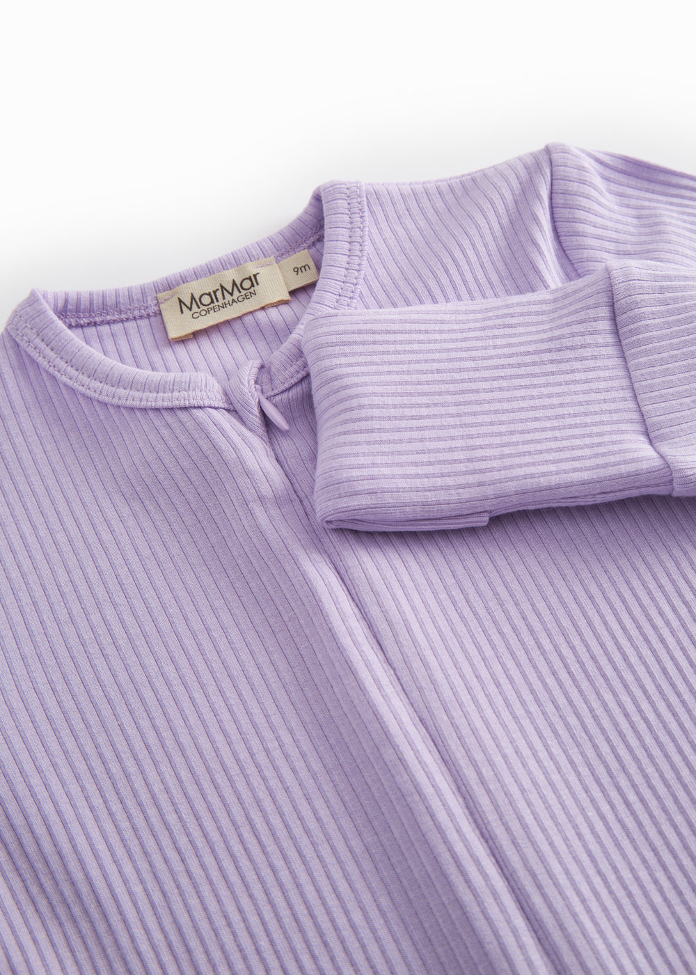 Pink long-sleeved baby outfit with snap buttons.