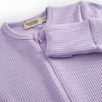 Pink long-sleeved baby outfit with snap buttons.