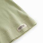 Short light green modal t-shirt for children with button-up closure.