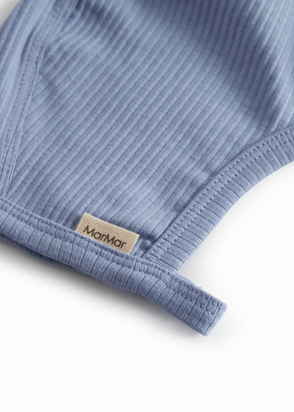 Light blue baby modal hue with button closure