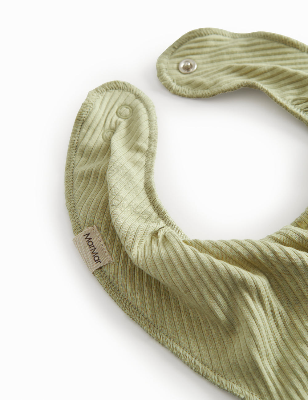 Green baby salve jars with a push button.