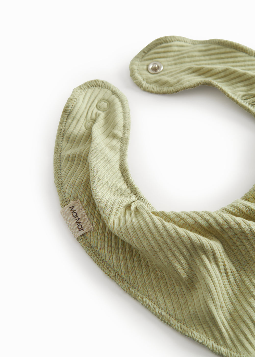 Green baby salve jars with a push button.