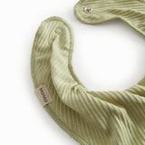 Green baby salve jars with a push button.