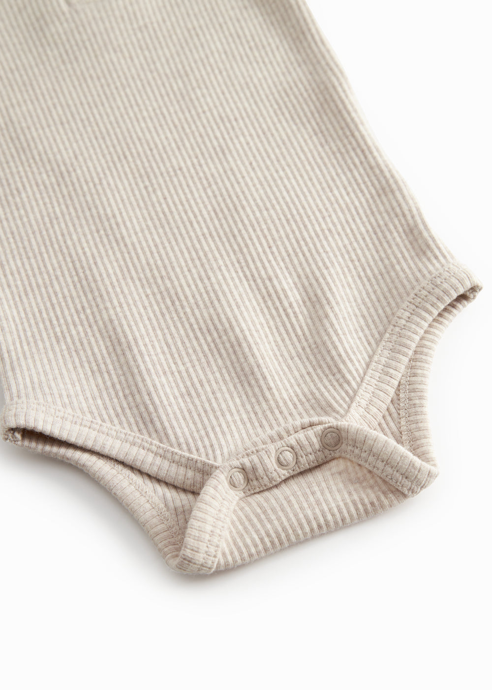 Beige baby pants with elastic and a decorative band at the waist.