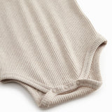 Short-sleeved baby modal bodystocking with snap closure.