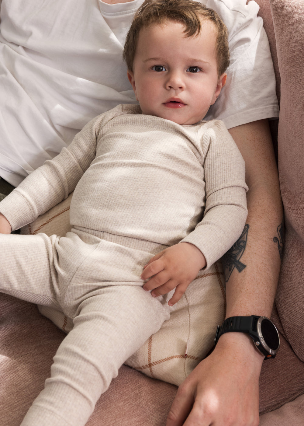 Baby wearing beige modal leggings and a matching body.