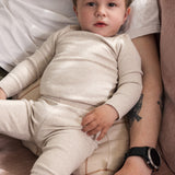 Baby wearing beige modal leggings and a matching body.