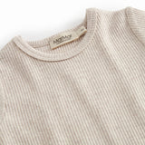 Short-sleeved beige baby modal romper with short legs