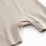 Short-sleeved beige baby modal romper with short legs
