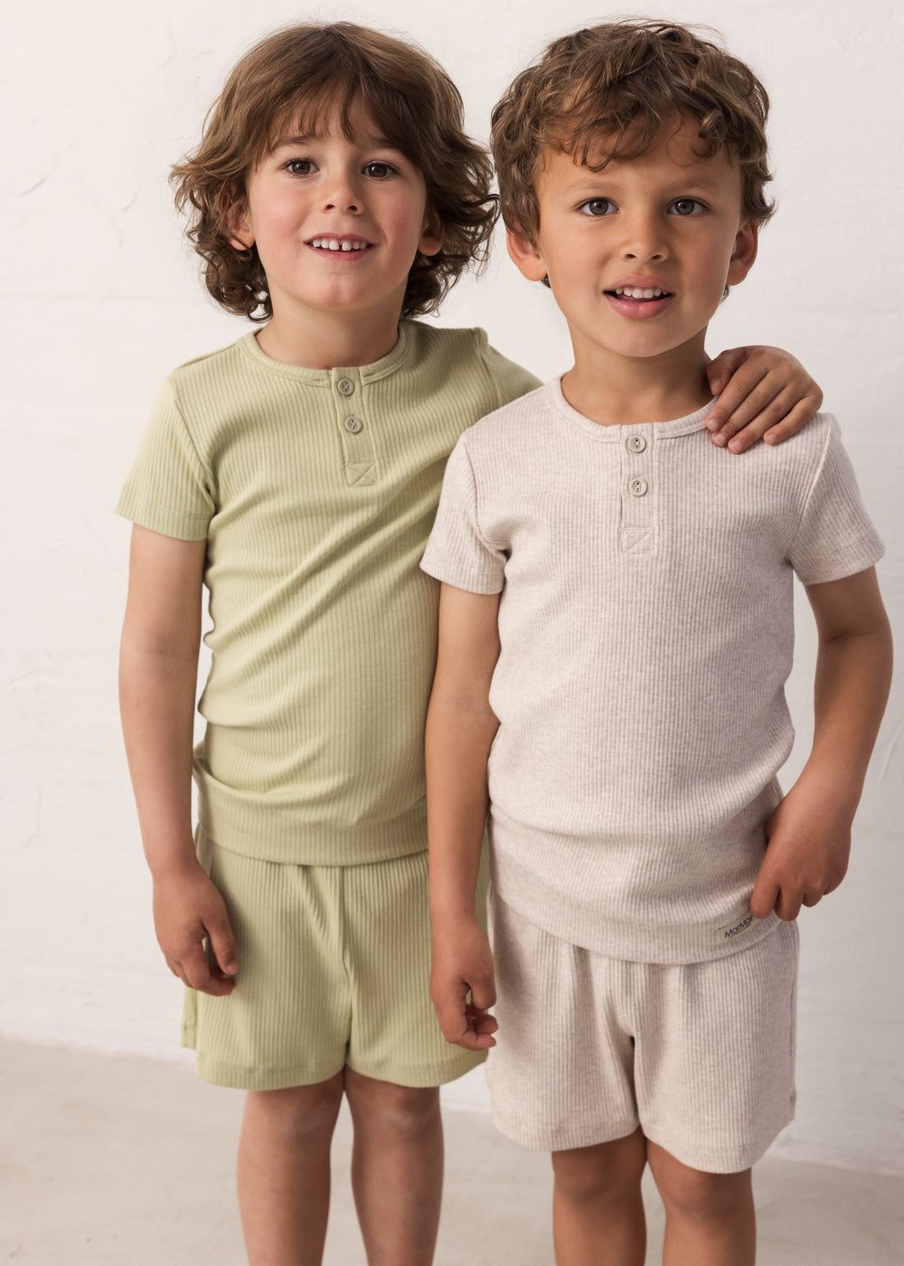 to children wearing ribbed t-shirts and shorts in neutral colors
