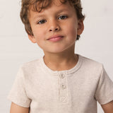children wearing a beige ribbed t-shirt with buttons