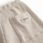 Beige Baby modal shorts with wide elastic and drawstring at the waist.
