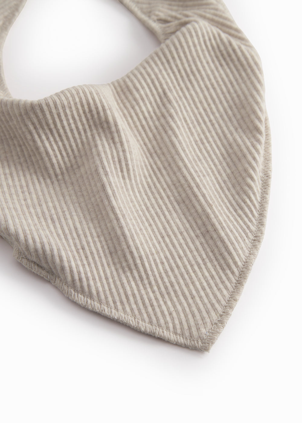 Beige baby salves that close with a button.