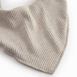 Beige baby salves that close with a button.