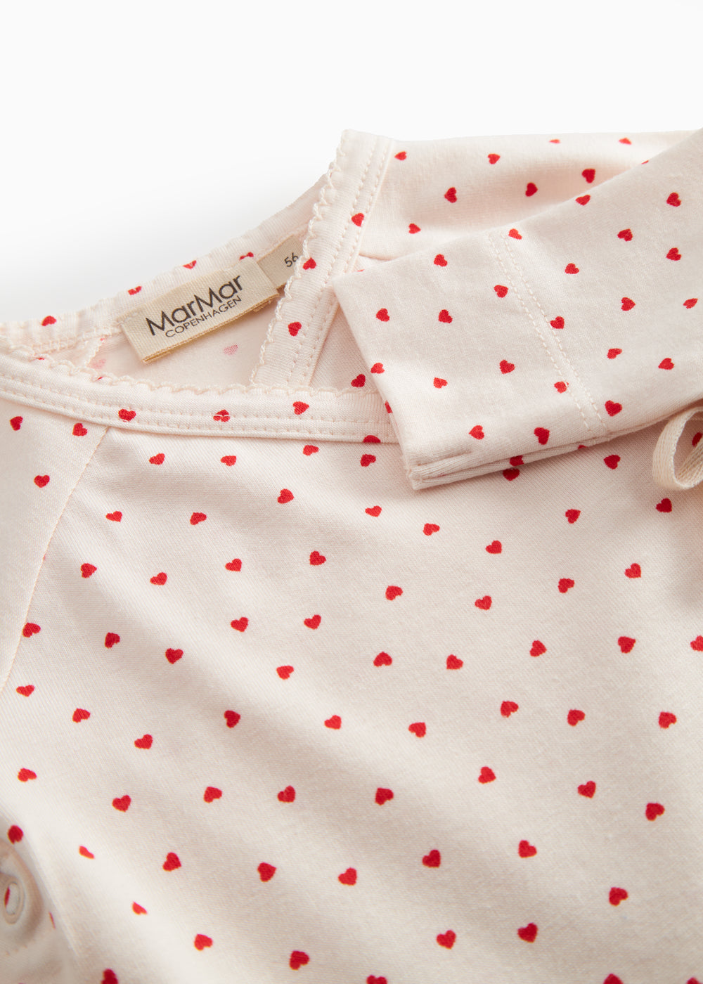 Langärmet bodystocking for newborns with snap closure and heart print